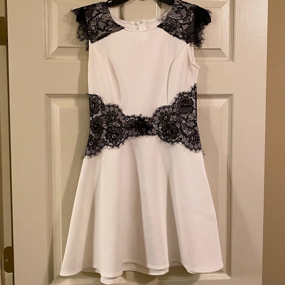 white dress with black lace overlay